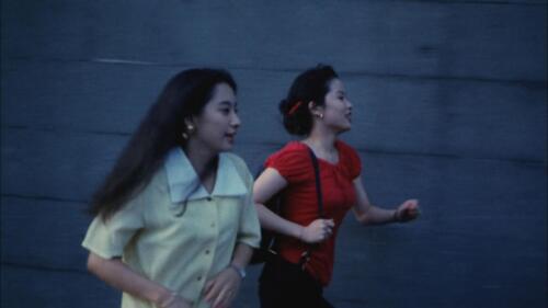 Rei and Ayumi run across Tokyo breathlessly.